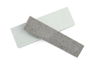 Photo of Sharpening stones for knife on white background, top view