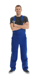 Full length portrait of professional auto mechanic with wrenches on white background