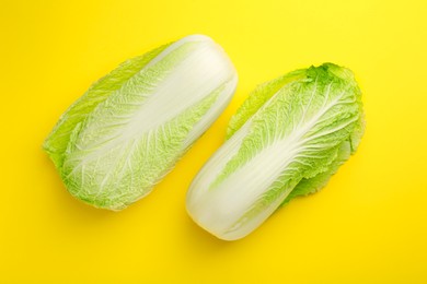 Photo of Fresh ripe Chinese cabbage on yellow background, top view