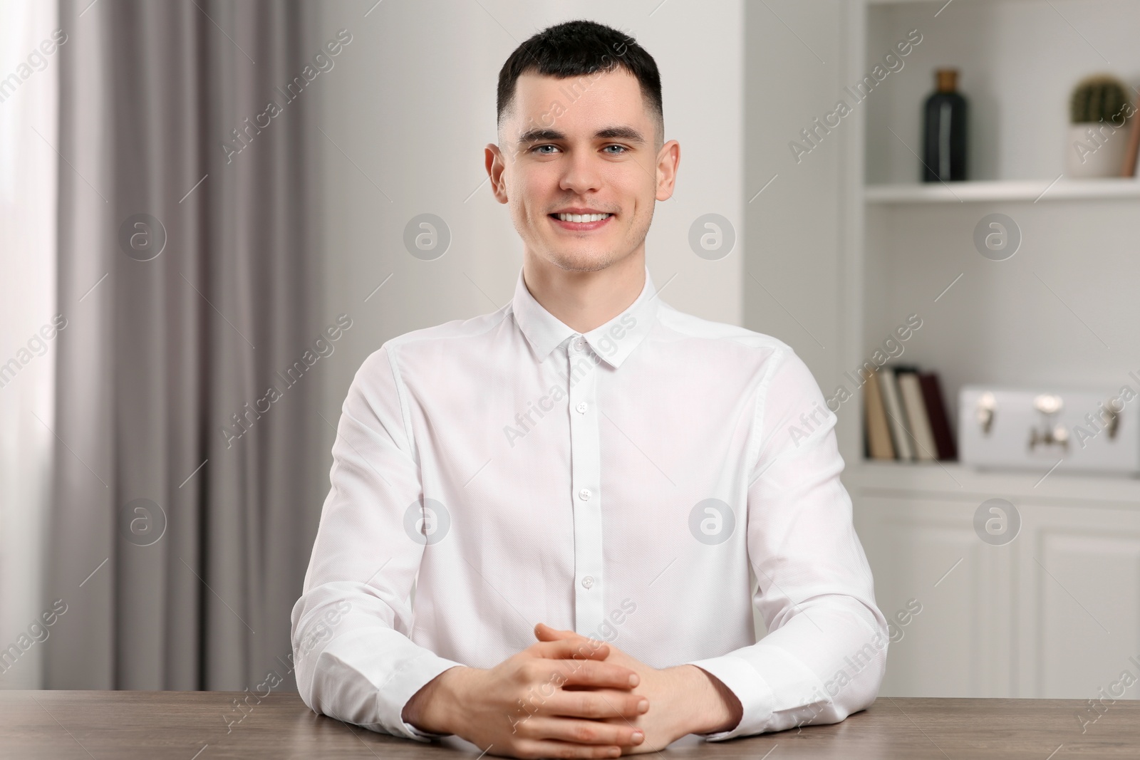 Photo of Young man having online video call at home, view from web camera