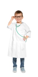 Cute little child in doctor coat with stethoscope on white background