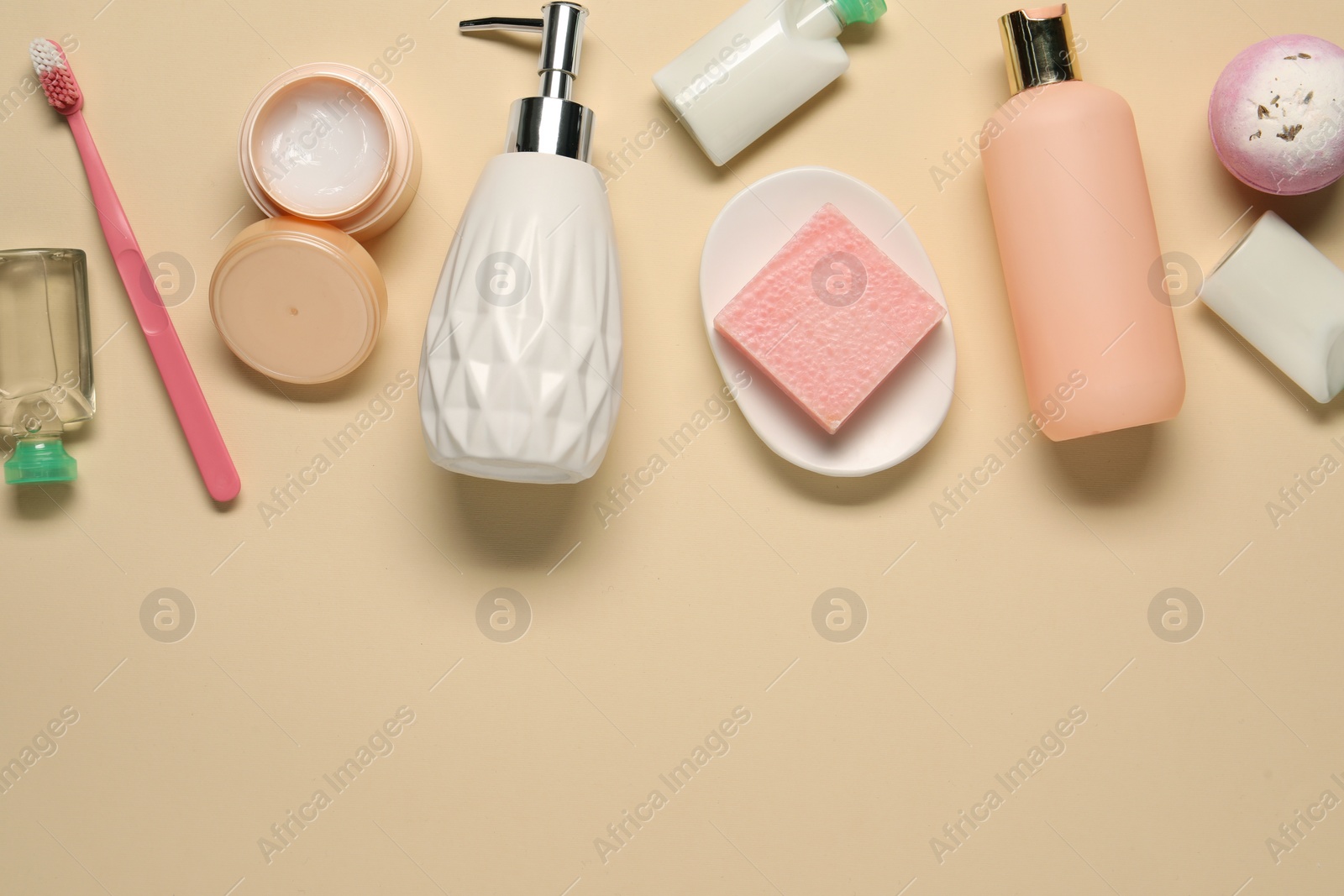 Photo of Bath accessories. Flat lay composition with personal care products on beige background, space for text