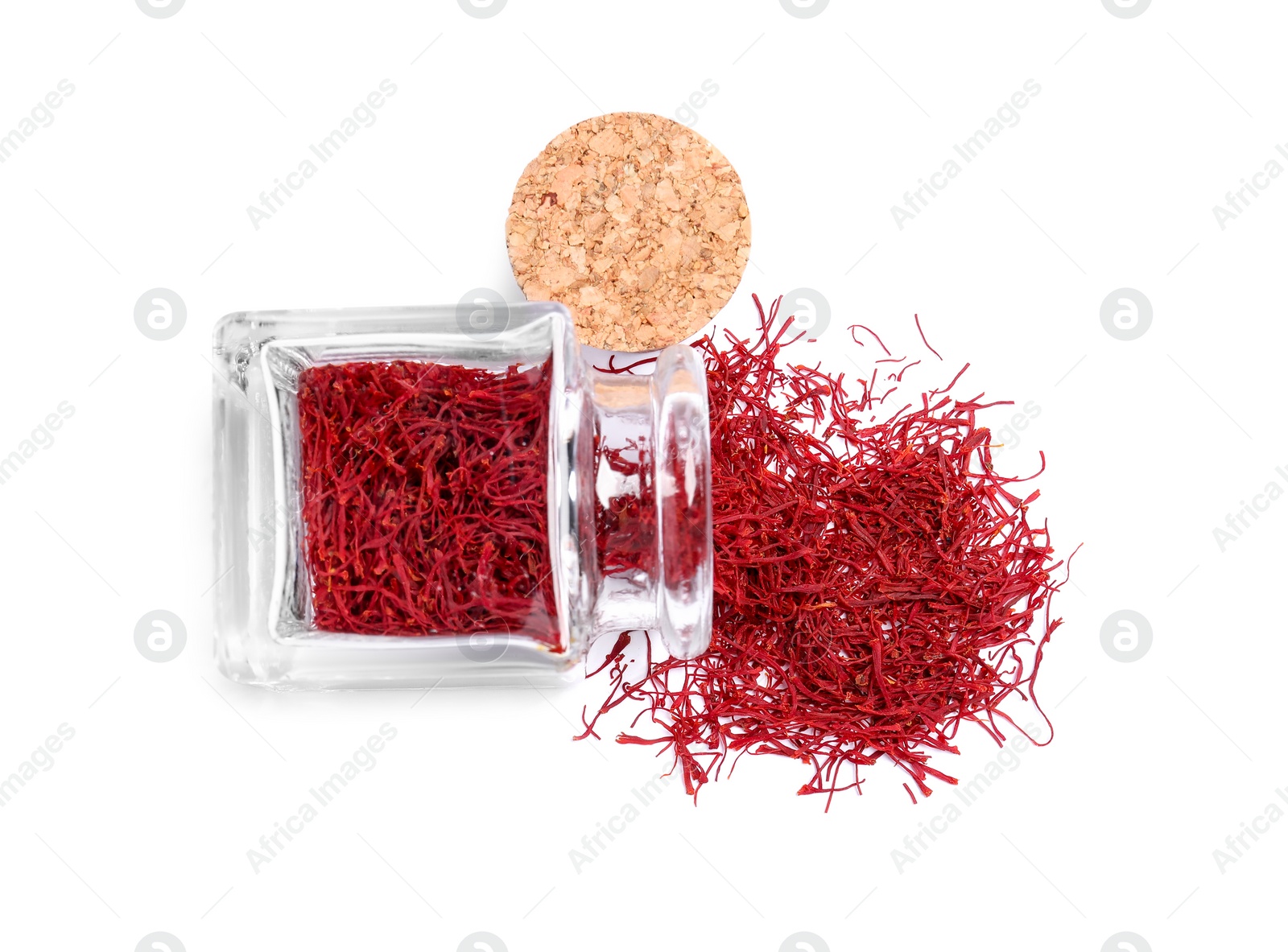 Photo of Aromatic saffron and glass jar isolated on white, top view