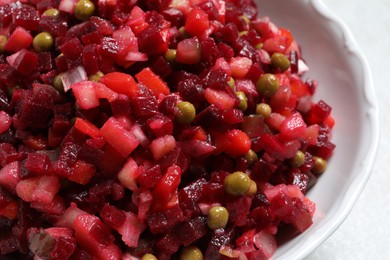 Photo of Delicious fresh vinaigrette salad in bowl, closeup