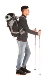 Male hiker with backpack and trekking poles on white background