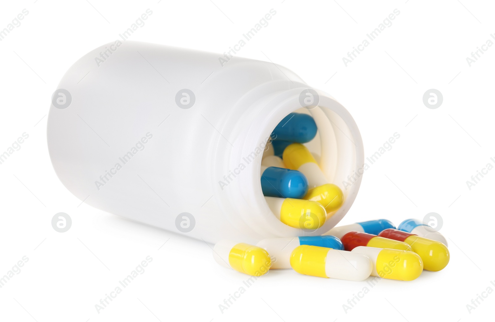 Photo of Scattered antibiotic pills and bottle isolated on white