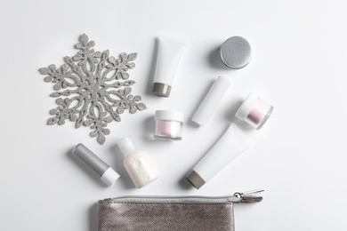 Photo of Set of cosmetic products on white background, flat lay. Winter care
