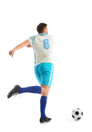 Young man playing football on white background