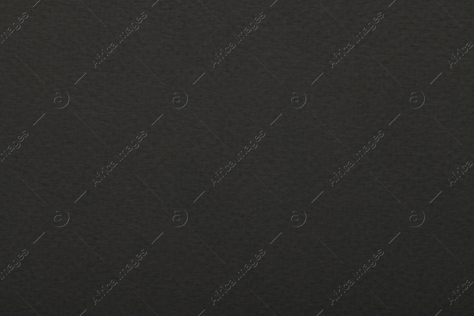 Photo of Texture of dark grey paper sheet as background, top view
