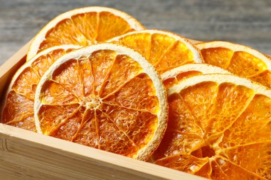 Crate of dry orange slices, closeup view