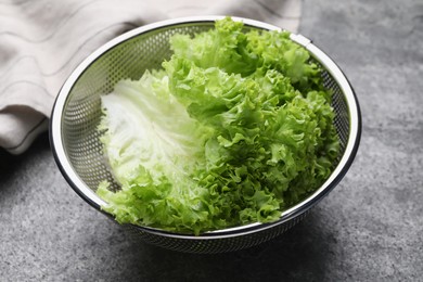 Photo of Fresh lettuce on stone table. Salad greens