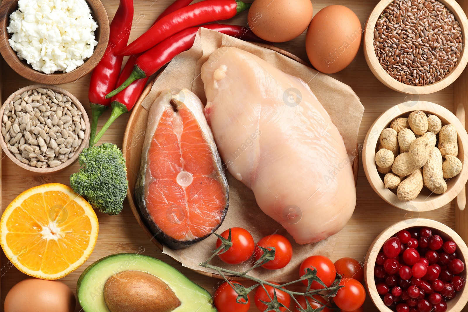 Photo of Many different healthy food on wooden table, flat lay