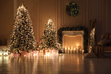 Festive room interior with beautiful Christmas trees