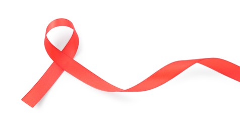 Photo of Red awareness ribbon isolated on white, top view