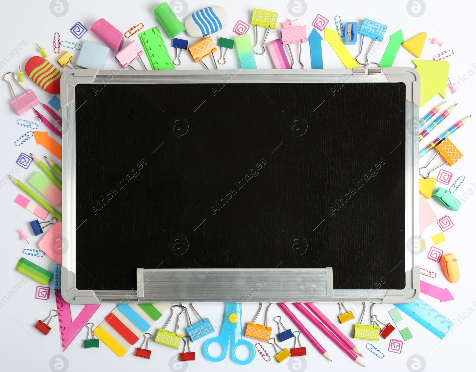 Photo of Composition with different school stationery and small chalkboard on white background, top view