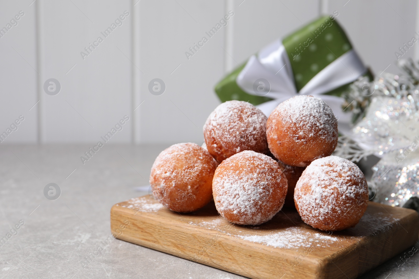 Photo of Delicious sweet buns on gray table, space for text