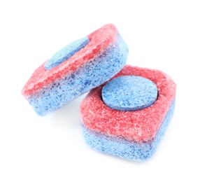 Photo of Two dishwasher detergent tablets on white background