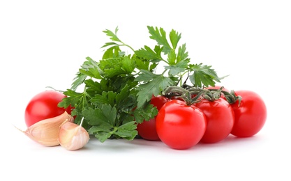 Photo of Green fresh parsley with tomatoes and garlic on white background