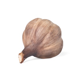 Unpeeled bulb of black garlic on white background