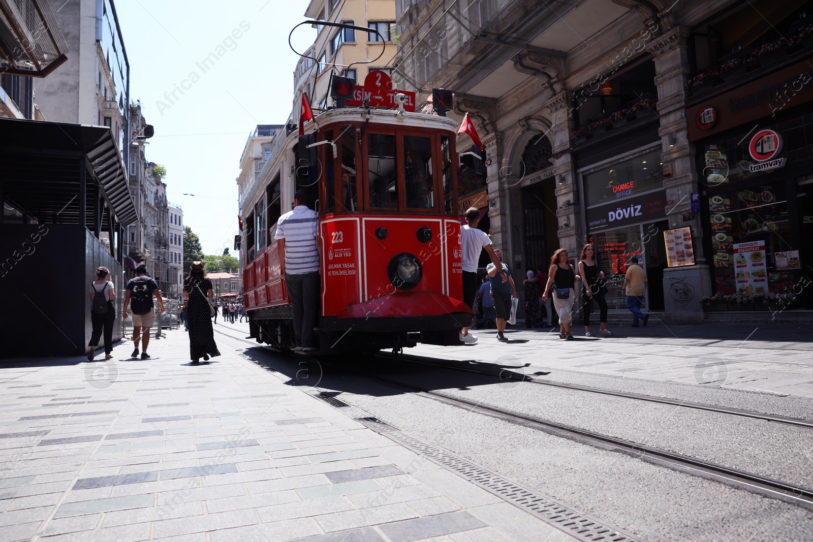 Photo of ISTANBUL, TURKEY - AUGUST 10, 2019: Old tram and people on city street