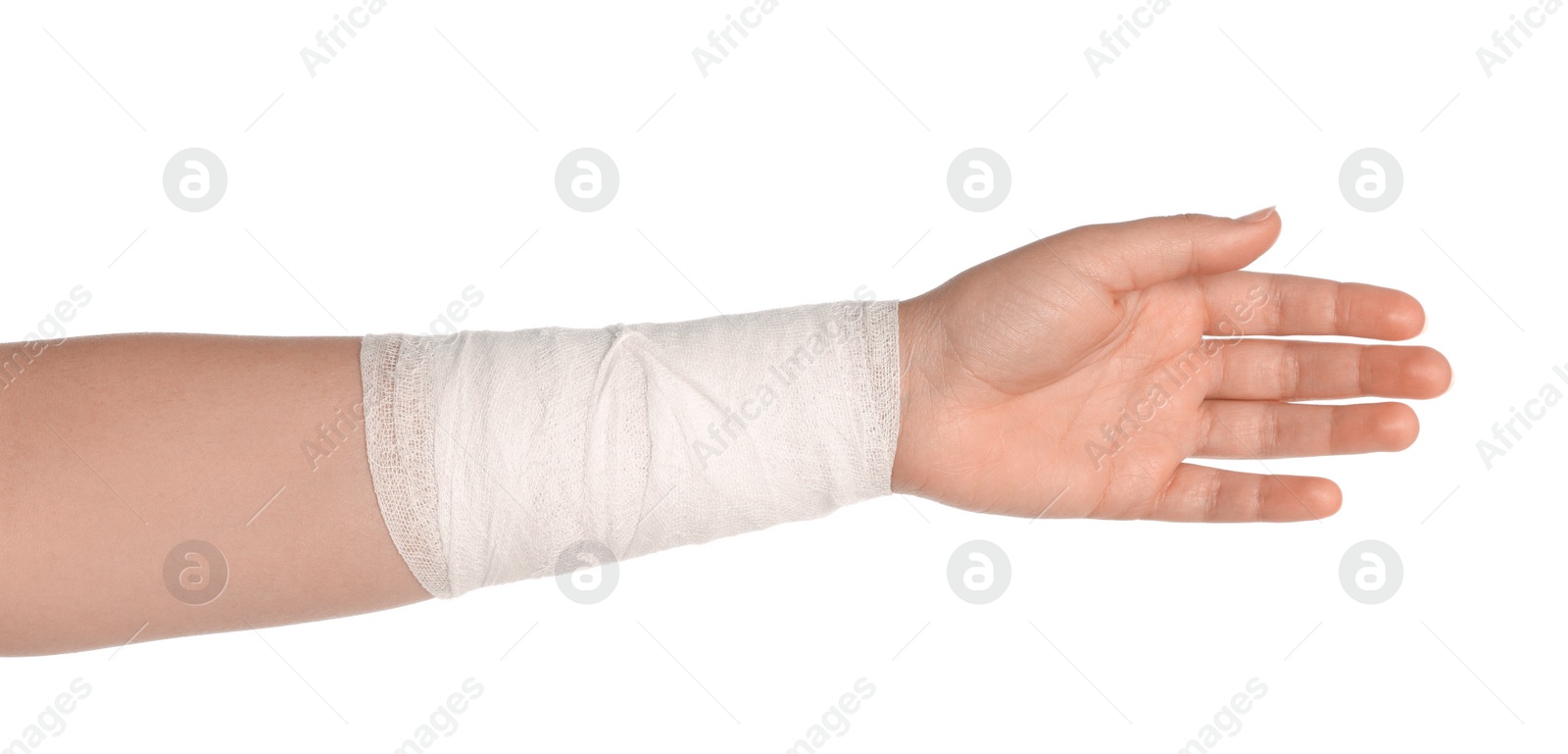 Photo of Woman with wrist wrapped in medical bandage on white background, closeup