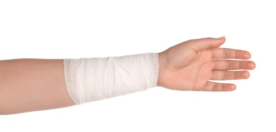 Photo of Woman with wrist wrapped in medical bandage on white background, closeup