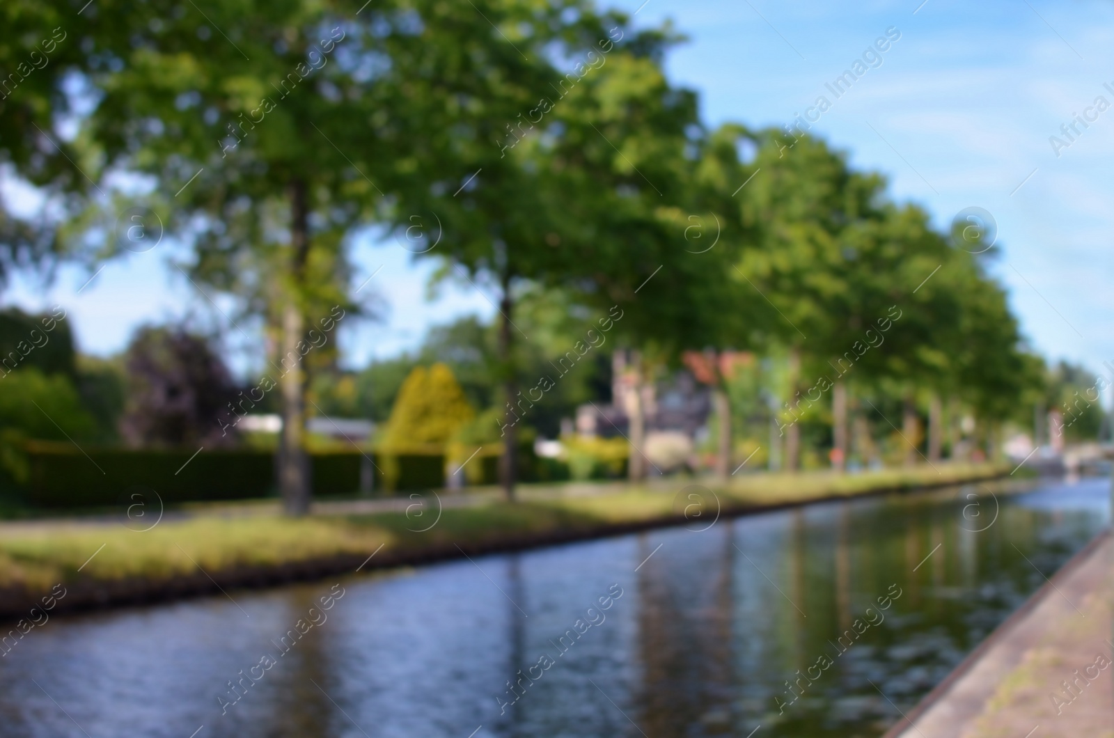 Photo of Blurred view of beautiful city canal on sunny day