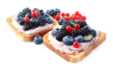 Photo of Tasty sandwiches with cream cheese and berries isolated on white