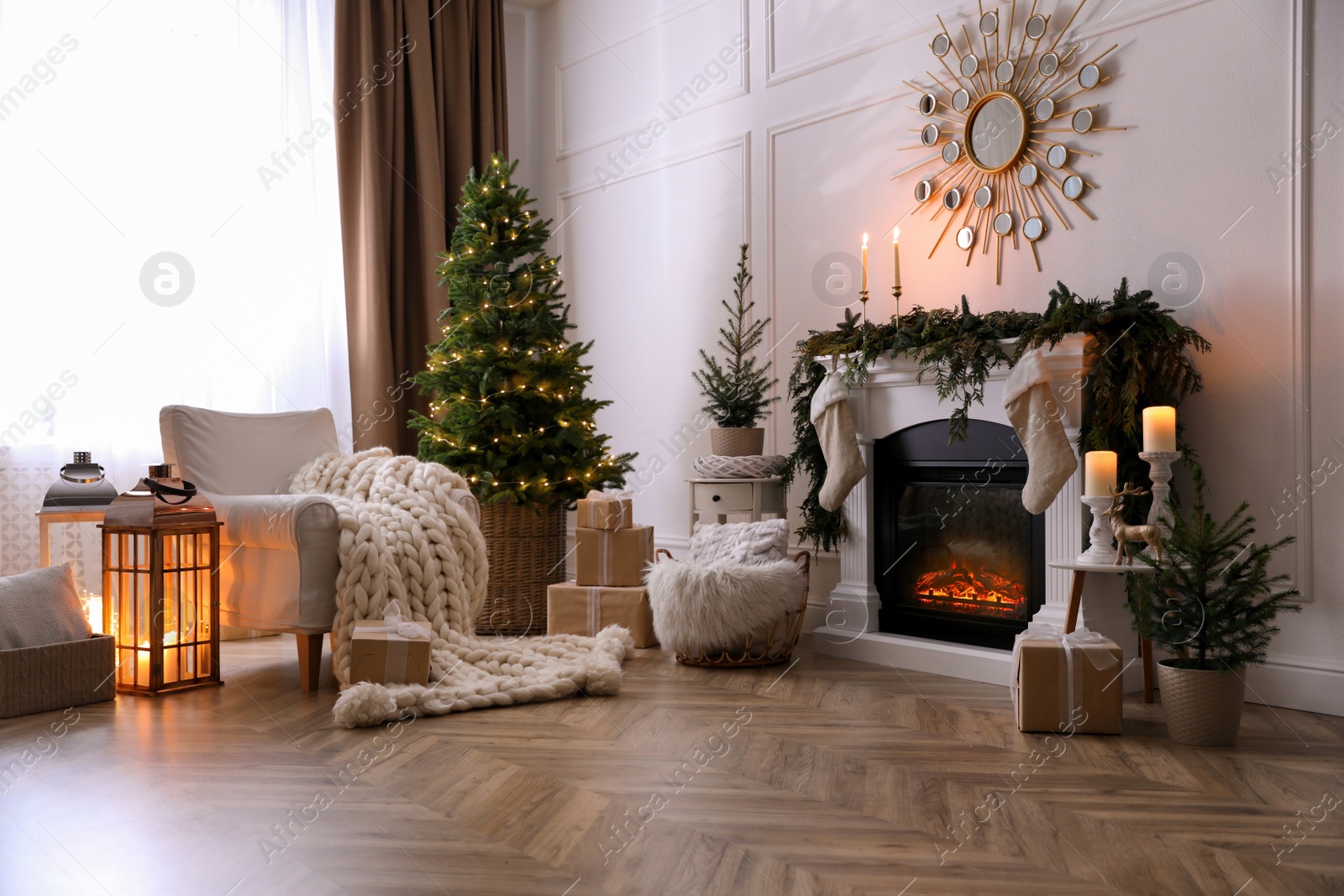 Photo of Stylish room interior with fireplace and beautiful Christmas tree