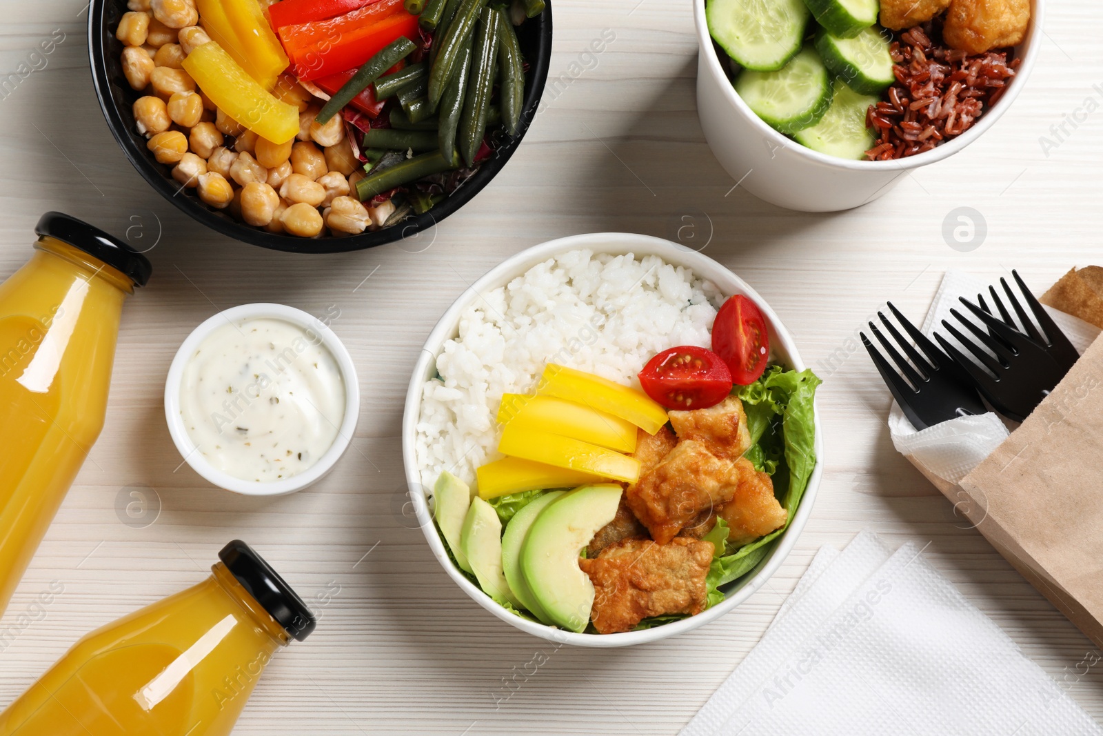 Photo of Flat lay composition with healthy takeaway food on white wooden table