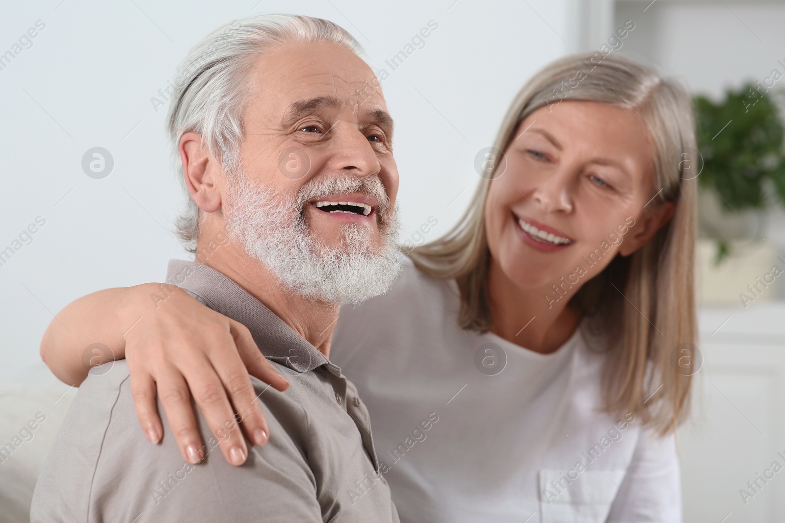 Photo of Happy senior couple spending time together at home