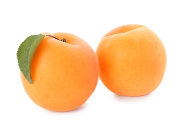 Photo of Delicious ripe sweet apricots isolated on white