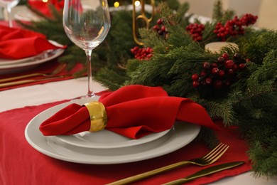 Photo of Beautiful festive table setting with Christmas decor