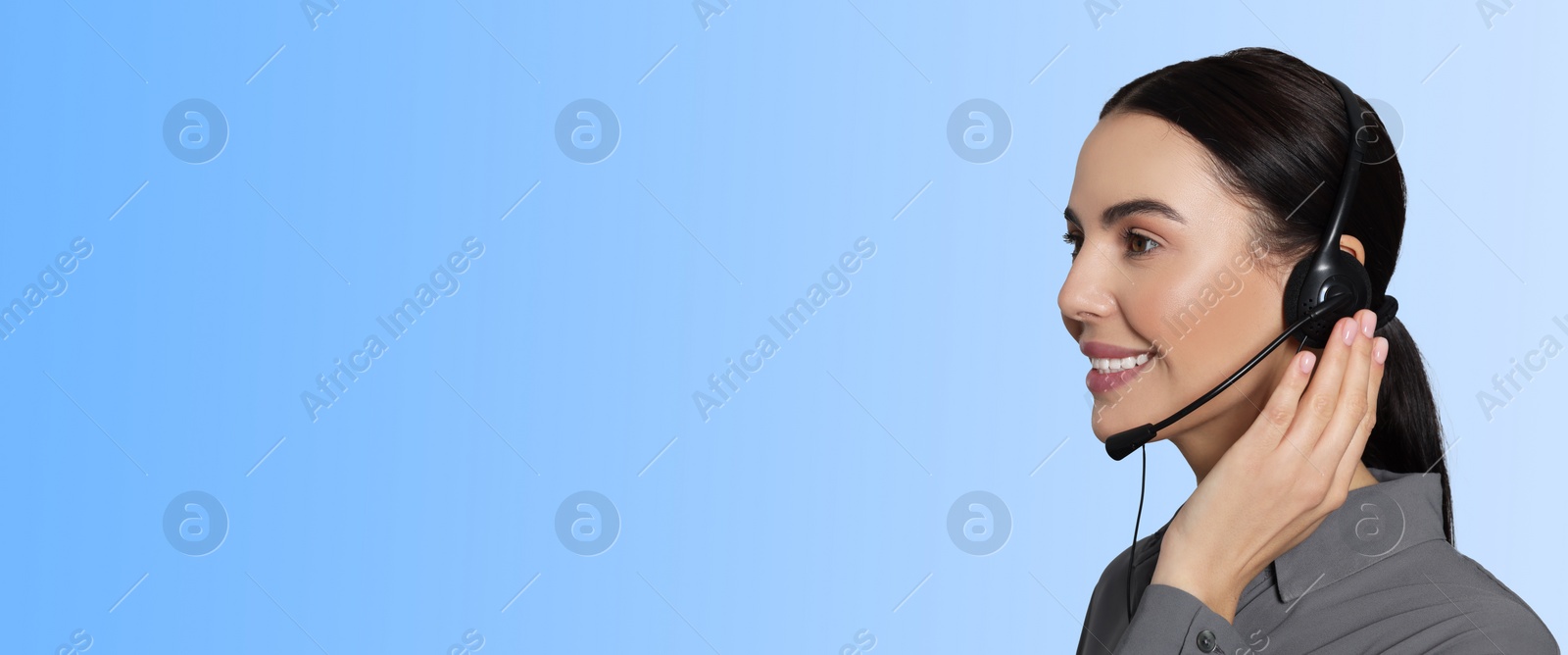 Image of Hotline operator with headset on light blue background, space for text. Banner design