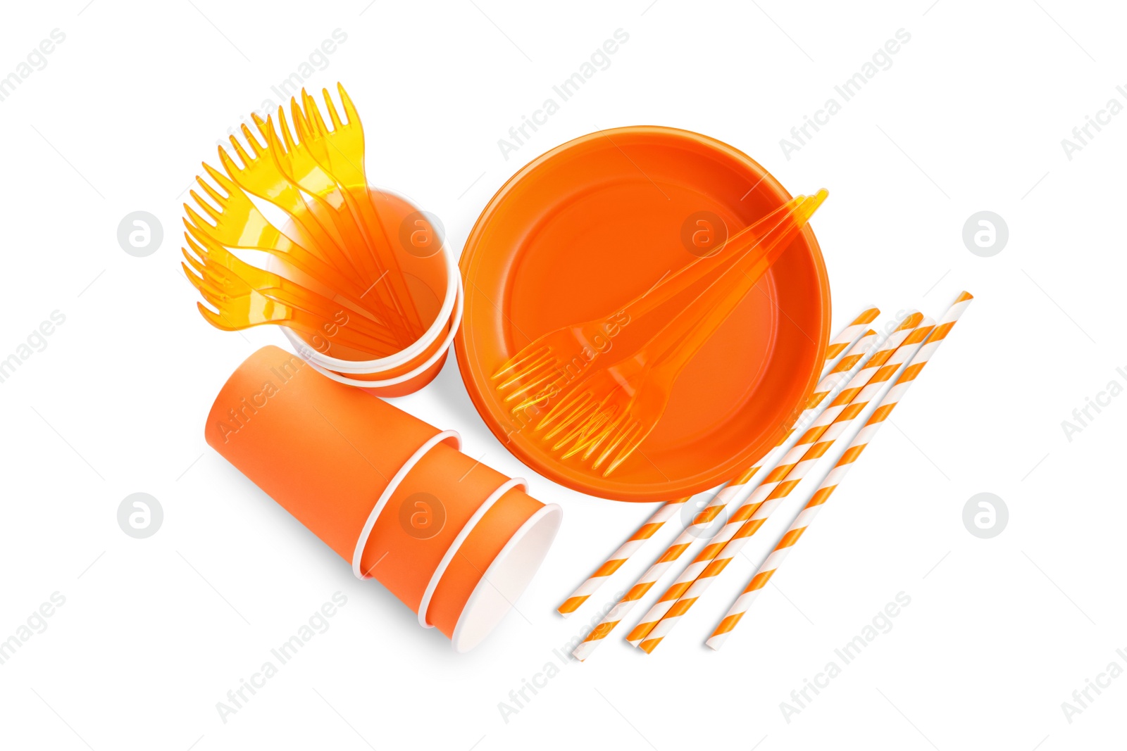 Photo of Set of bright disposable tableware on white background, top view