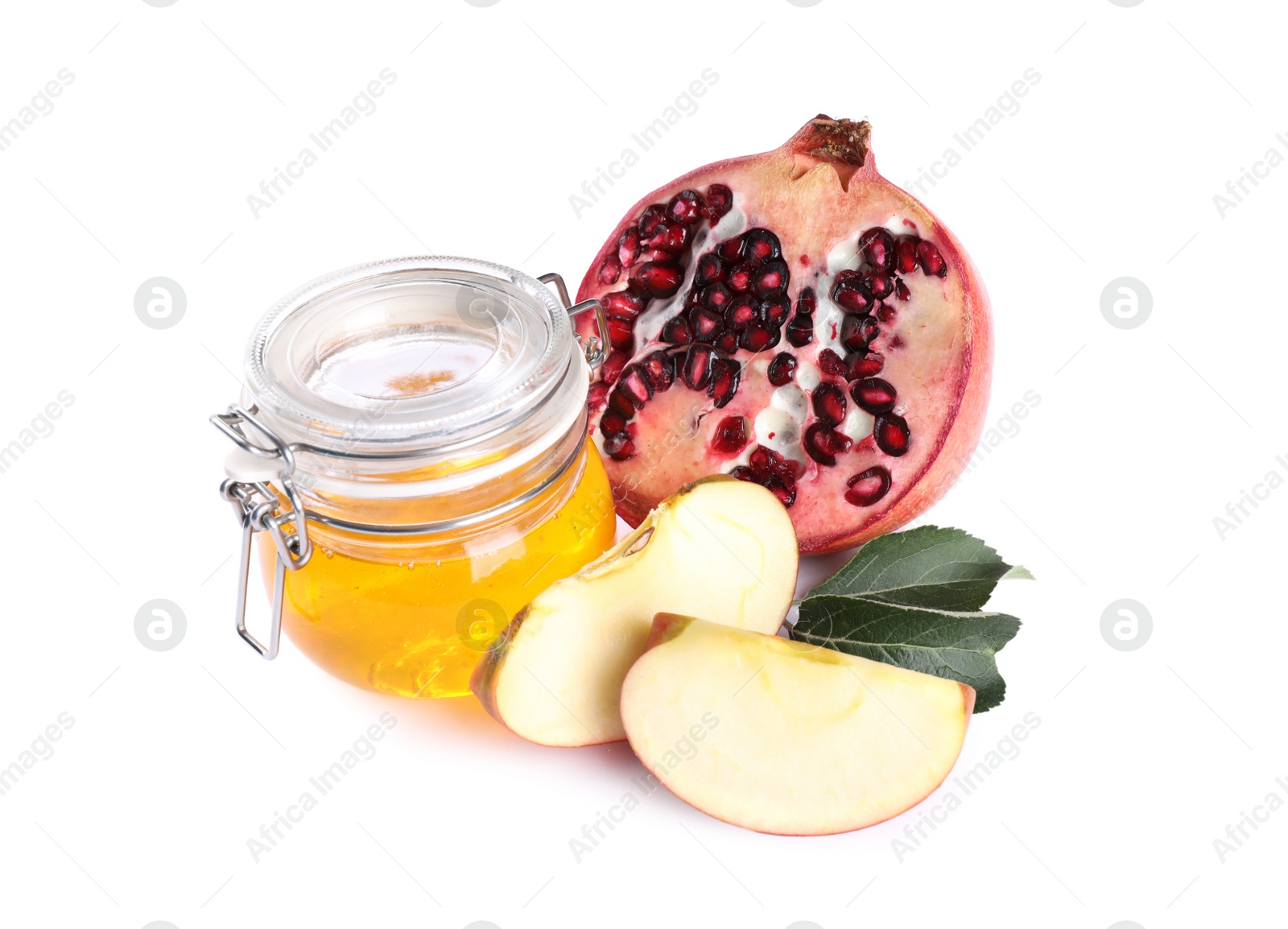 Photo of Honey, apple slices and pomegranate on white background. Rosh Hashanah holiday