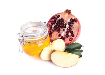 Honey, apple slices and pomegranate on white background. Rosh Hashanah holiday