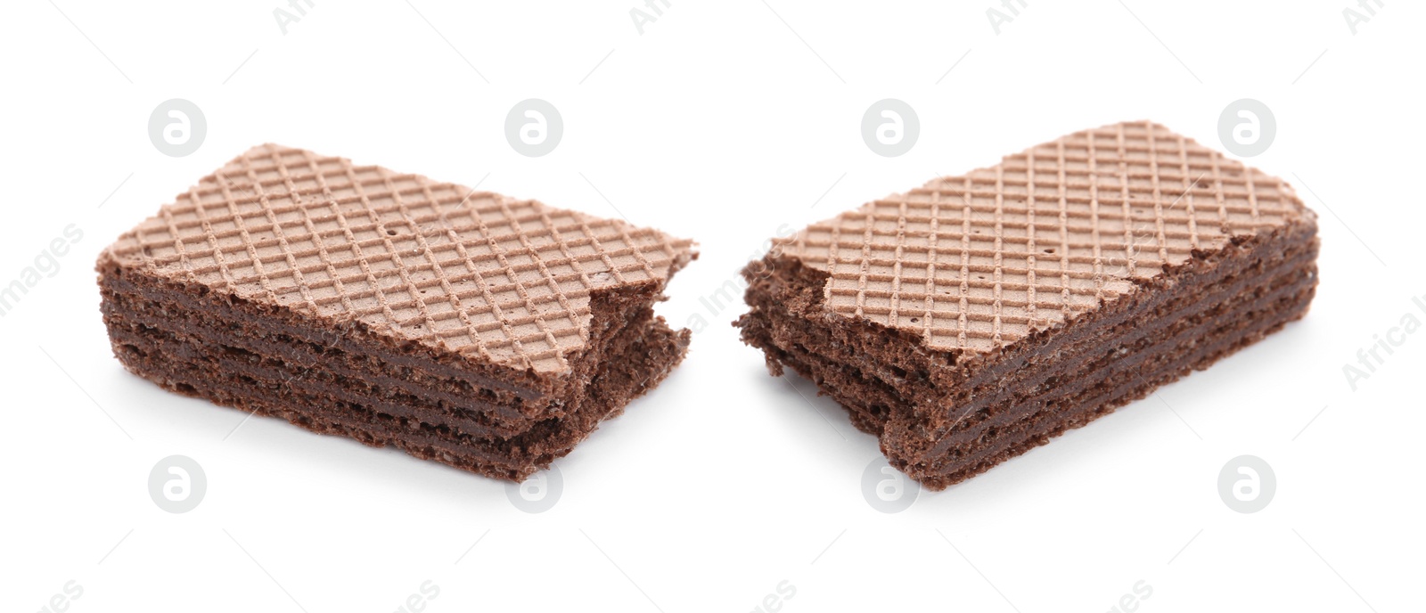 Photo of Delicious broken crispy wafer on white background. Sweet food