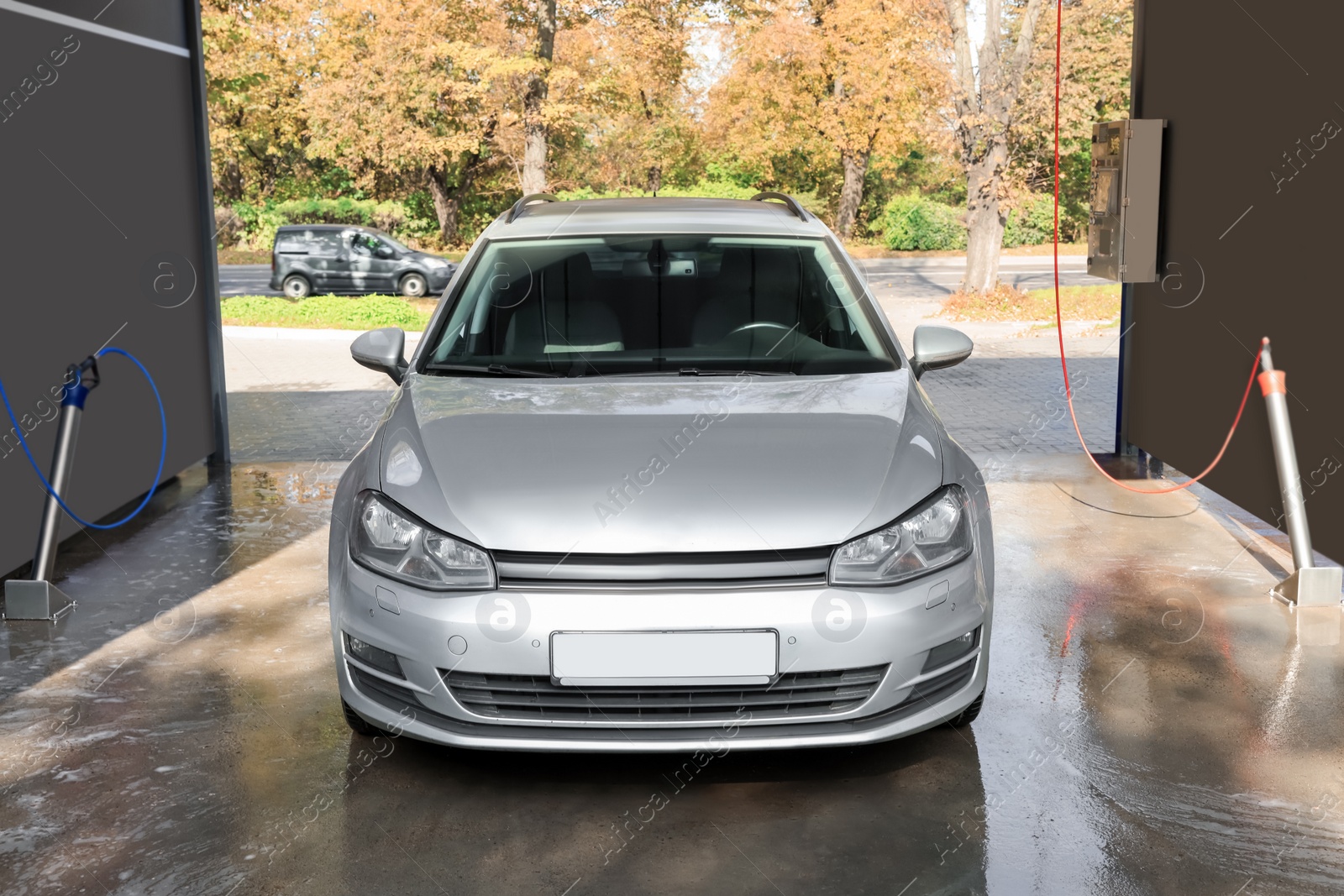 Photo of Silver wet auto at outdoor car wash