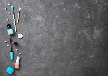 Photo of Flat lay composition with professional makeup products on grey background