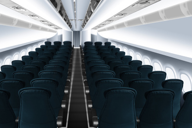 Image of Modern cabin with comfortable seats in airplane
