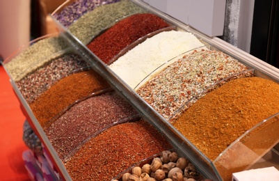 Photo of Assortment of colorful aromatic spices at market