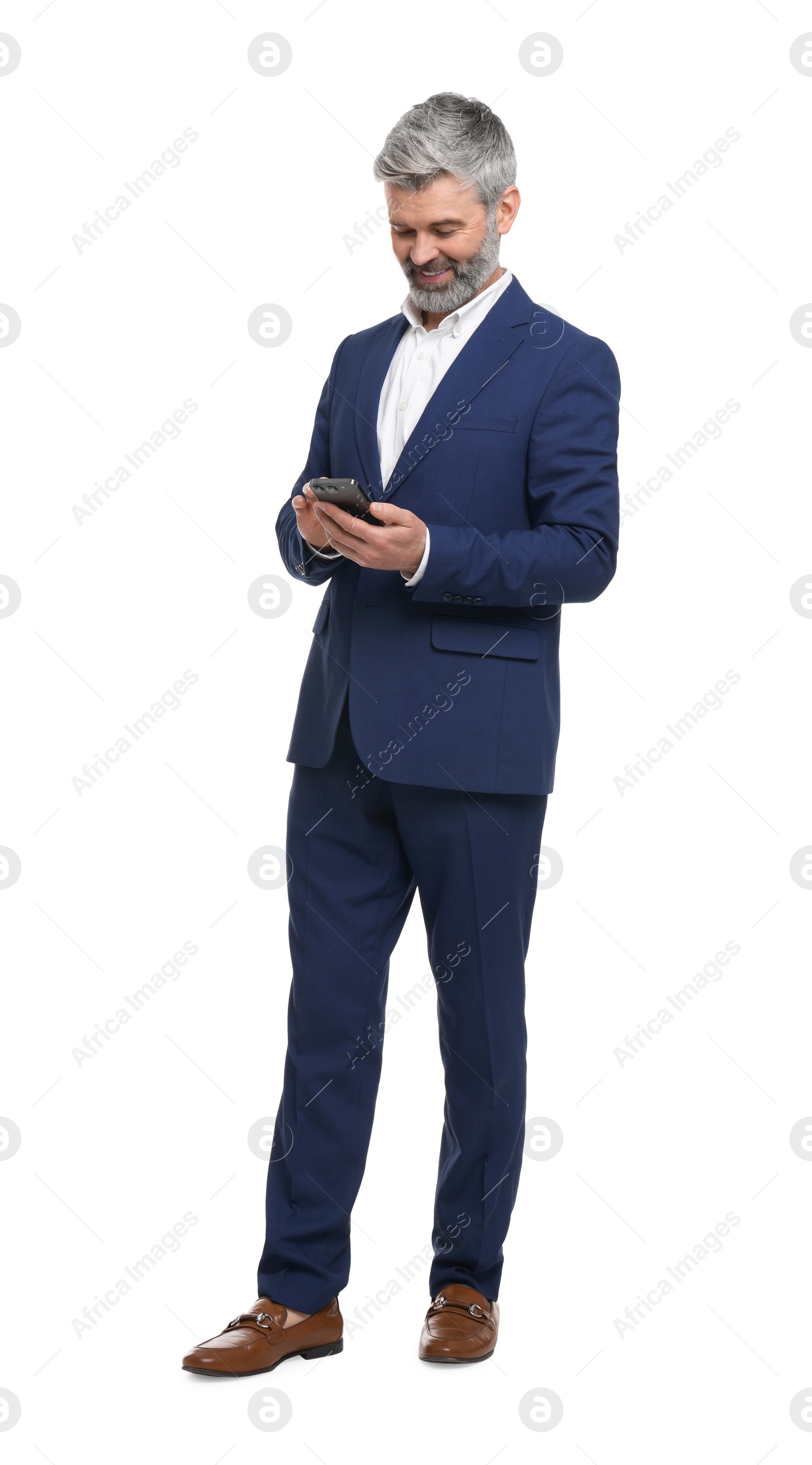 Photo of Mature businessman in stylish clothes using smartphone on white background