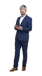 Mature businessman in stylish clothes using smartphone on white background