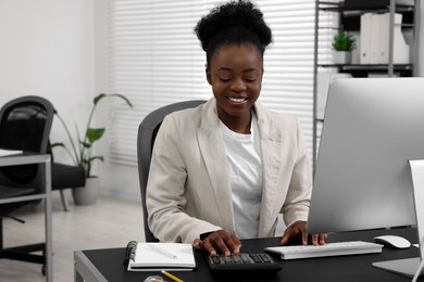 Professional accountant working at desk in office