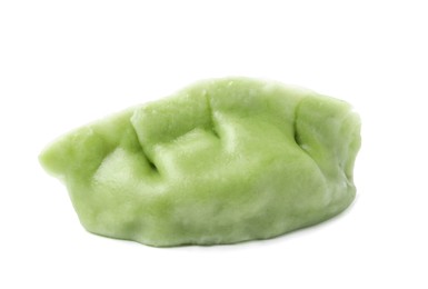Photo of One tasty green dumpling (gyoza) isolated on white