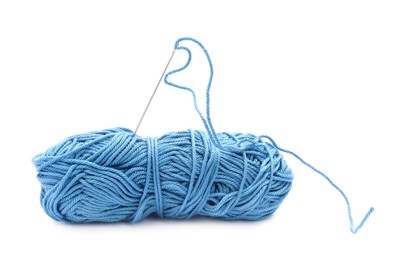 Photo of Clew of light blue thread with needle on white background