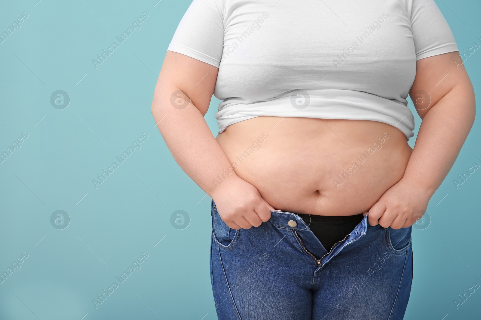 Photo of Overweight woman on color background