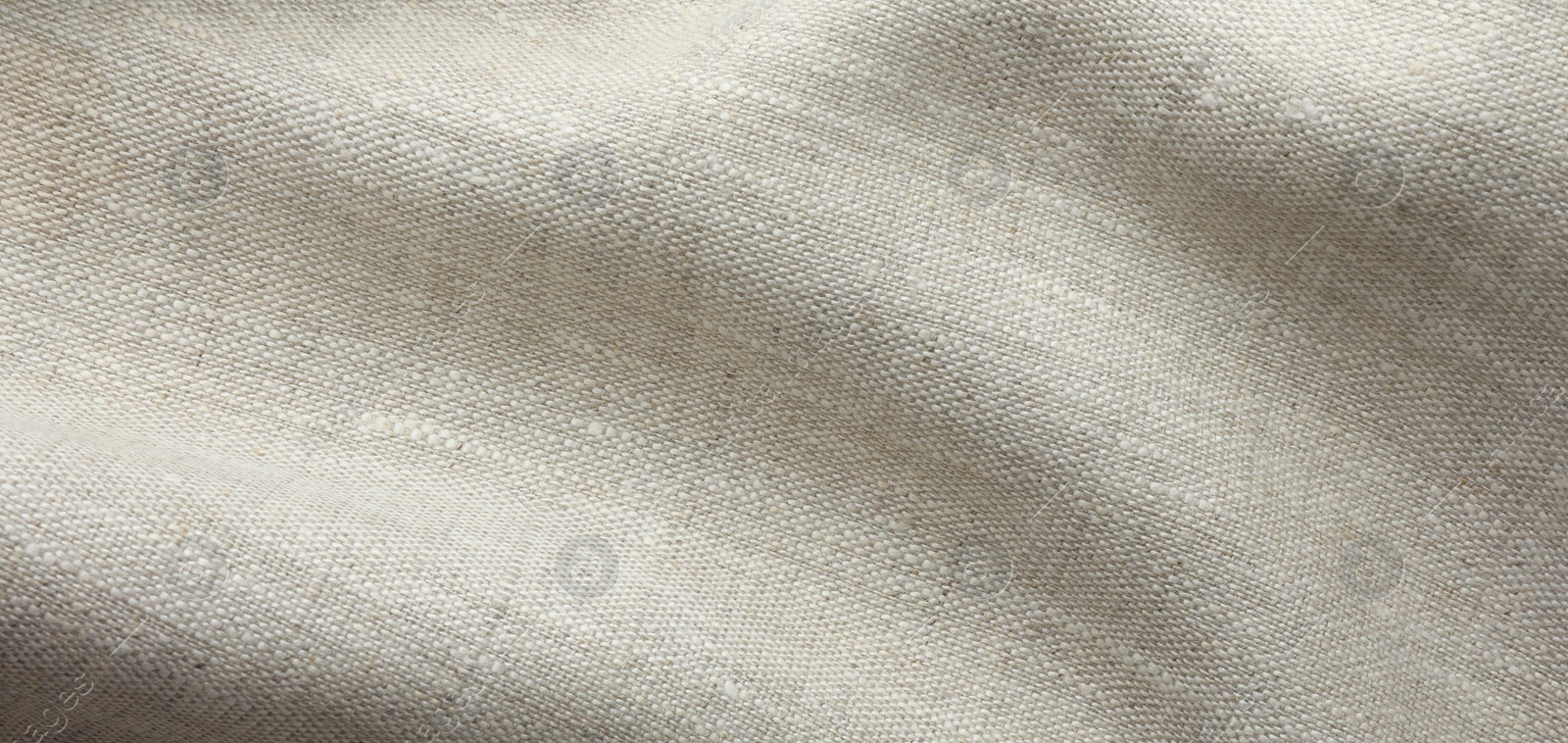 Photo of Texture of beige crumpled fabric as background, top view