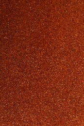 Photo of Orange textured surface as background, closeup view